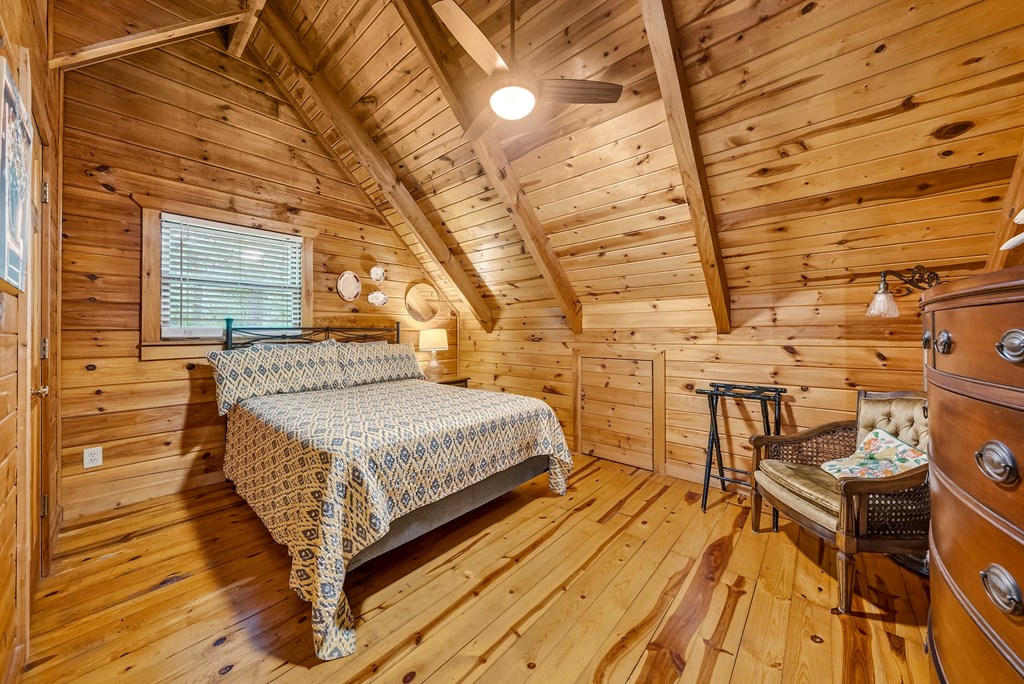 149 Mountain Springs Road Warm Springs, GA 31830 - Photo 28 of 43 a spacious bedroom with a bed and wooden floor