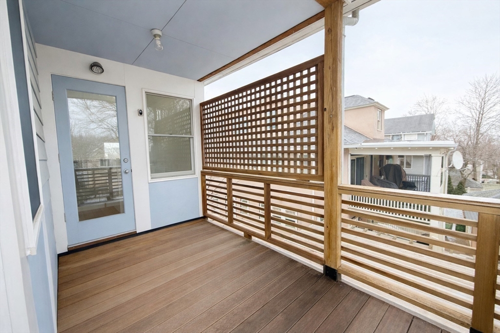 174 Maplewood Street, Unit 174 Watertown, MA 02472 - Photo 26 of 30 a view of a bedroom with wooden floor