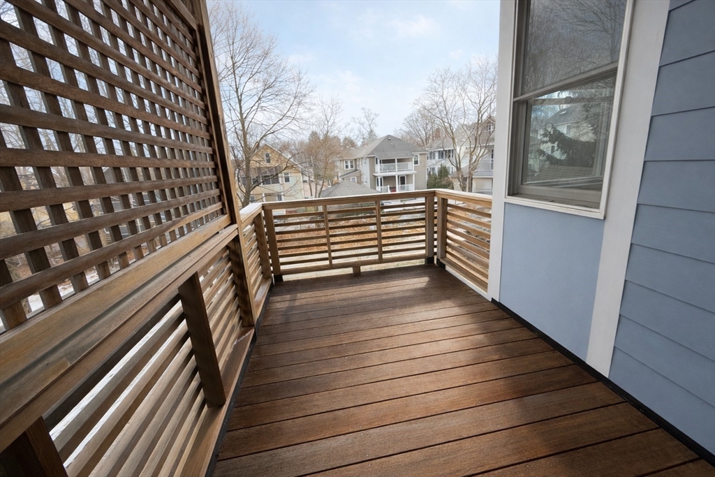 174 Maplewood Street, Unit 174 Watertown, MA 02472 - Photo 27 of 30 a view of a balcony with wooden floor