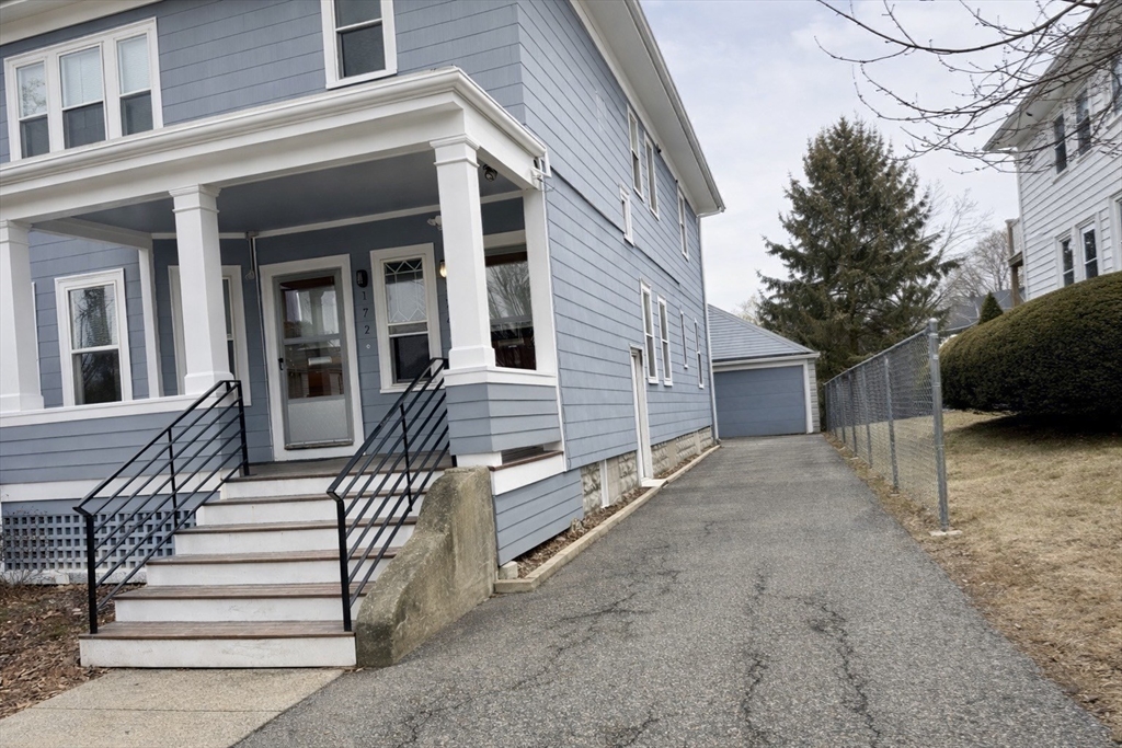 174 Maplewood Street, Unit 174 Watertown, MA 02472 - Photo 29 of 30 a view of a house with more windows and wooden fence