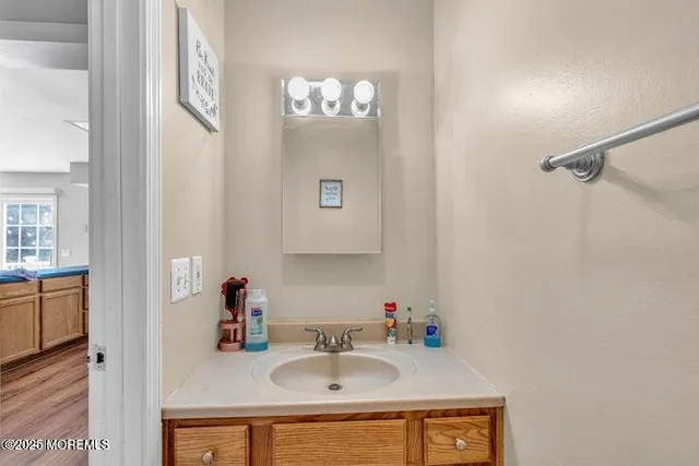 a bathroom with a sink and a mirror