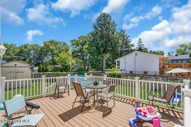 a view of a deck with furniture