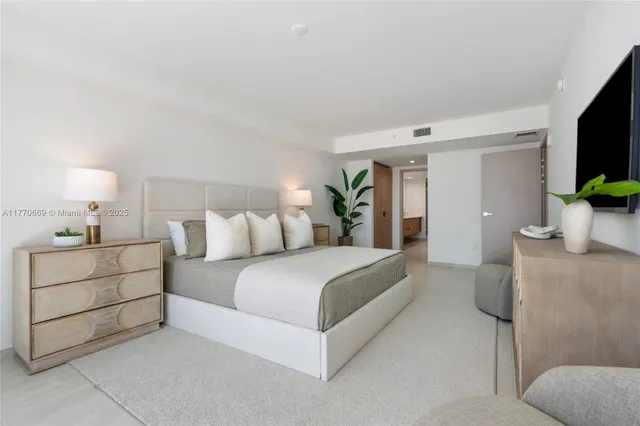 a bed room with a bed and a couch