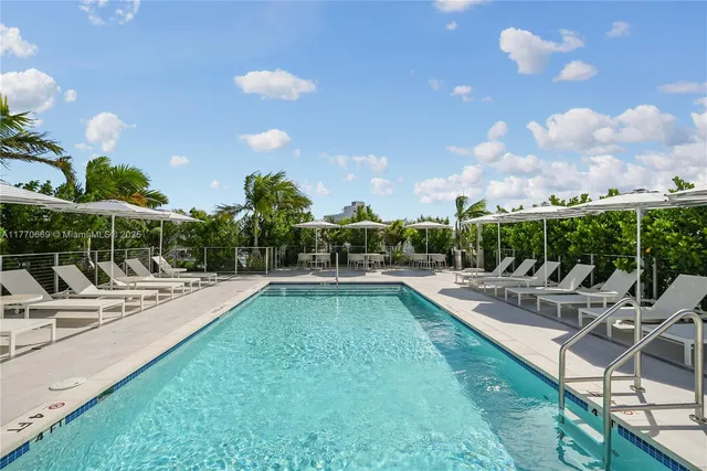 a view of a swimming pool with a patio