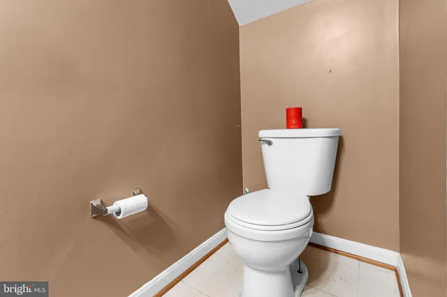 a bathroom with a toilet and a sink