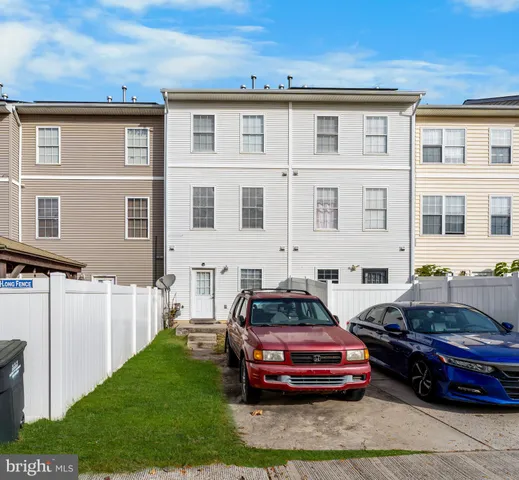 a front view of a house with parking space
