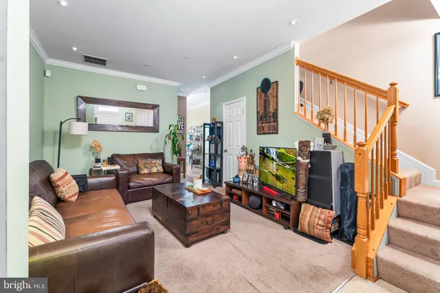 a living room with fireplace furniture and a flat screen tv
