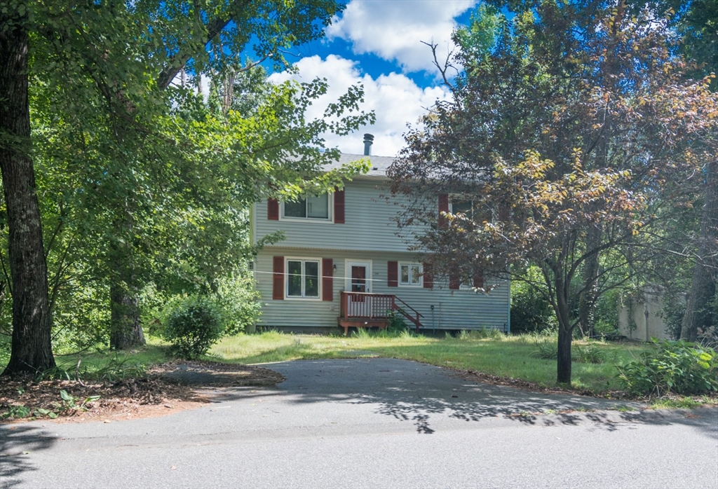 248 Monson Turnpike Road Ware, MA 01082 - Photo 2 of 2 a front view of a house with a garden and tree