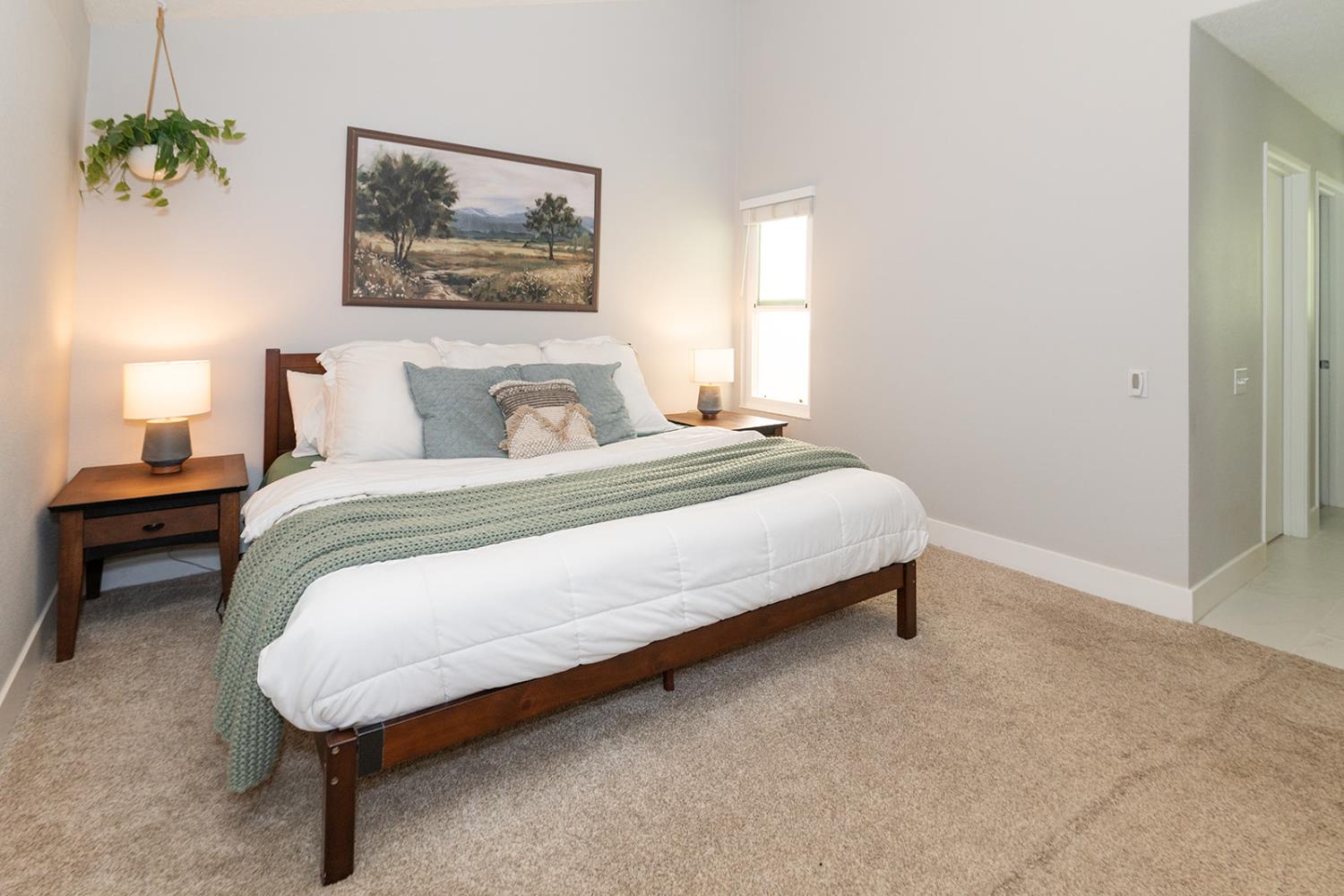 2672 Rio Bravo Circle Sacramento, CA 95826 - Photo 11 of 26 a bedroom with a bed and a painting on the wall