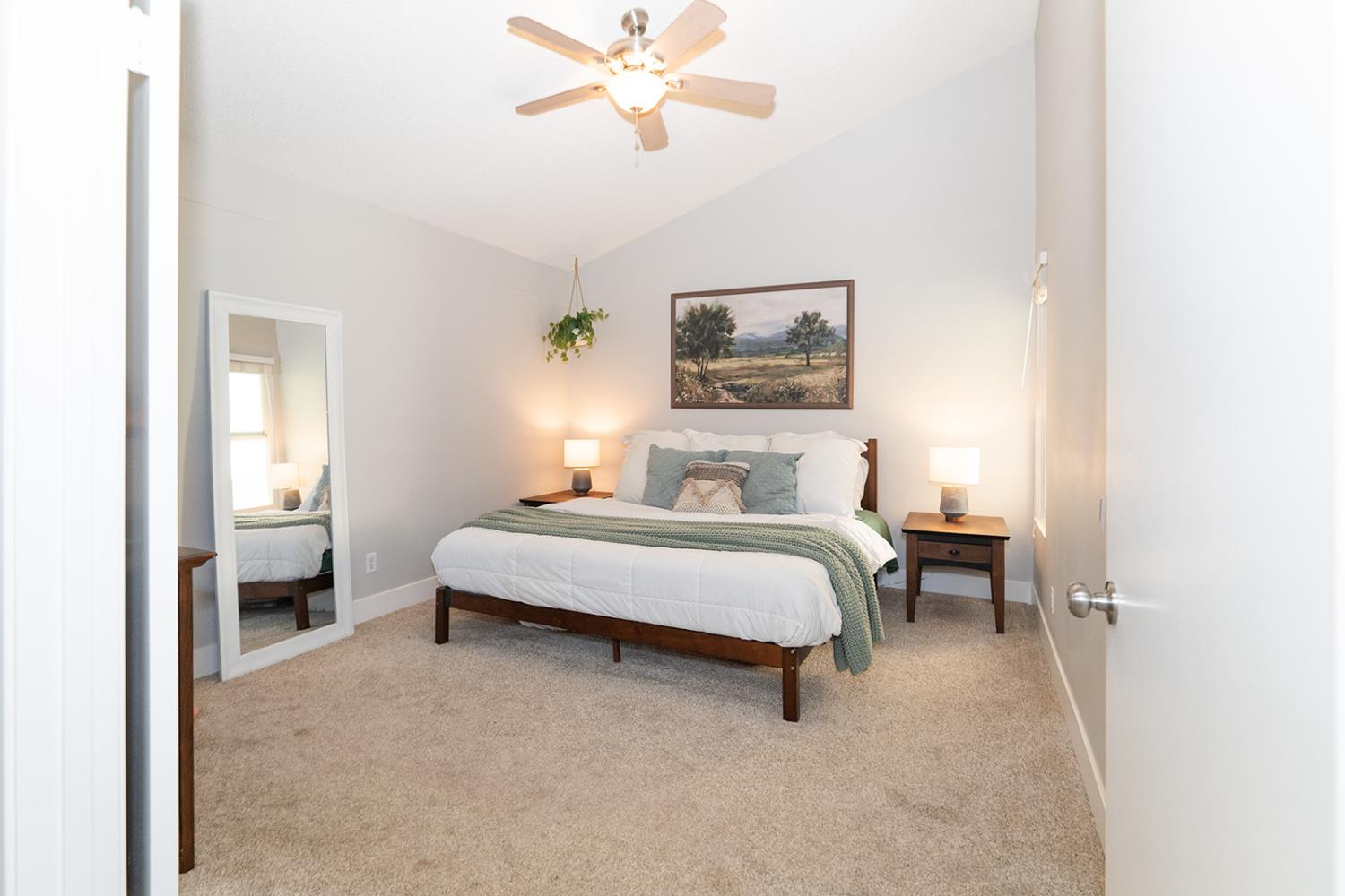 2672 Rio Bravo Circle Sacramento, CA 95826 - Photo 12 of 26 a spacious bedroom with a bed and a chandelier