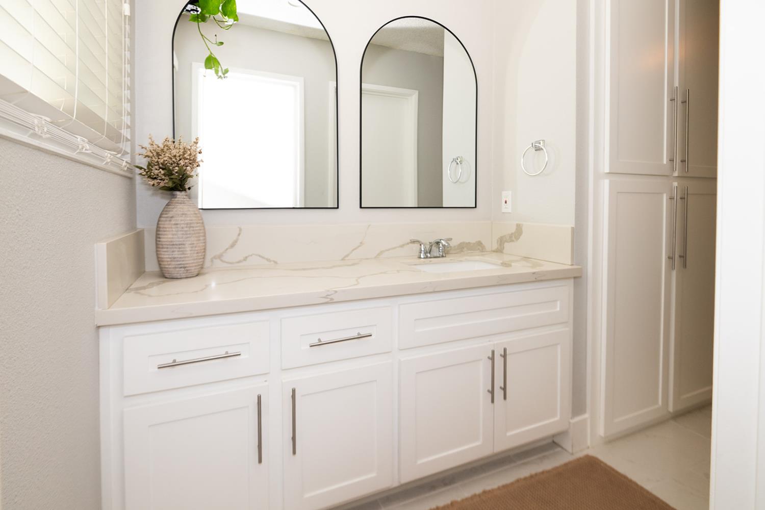 2672 Rio Bravo Circle Sacramento, CA 95826 - Photo 13 of 26 a bathroom with a double vanity sink and mirror