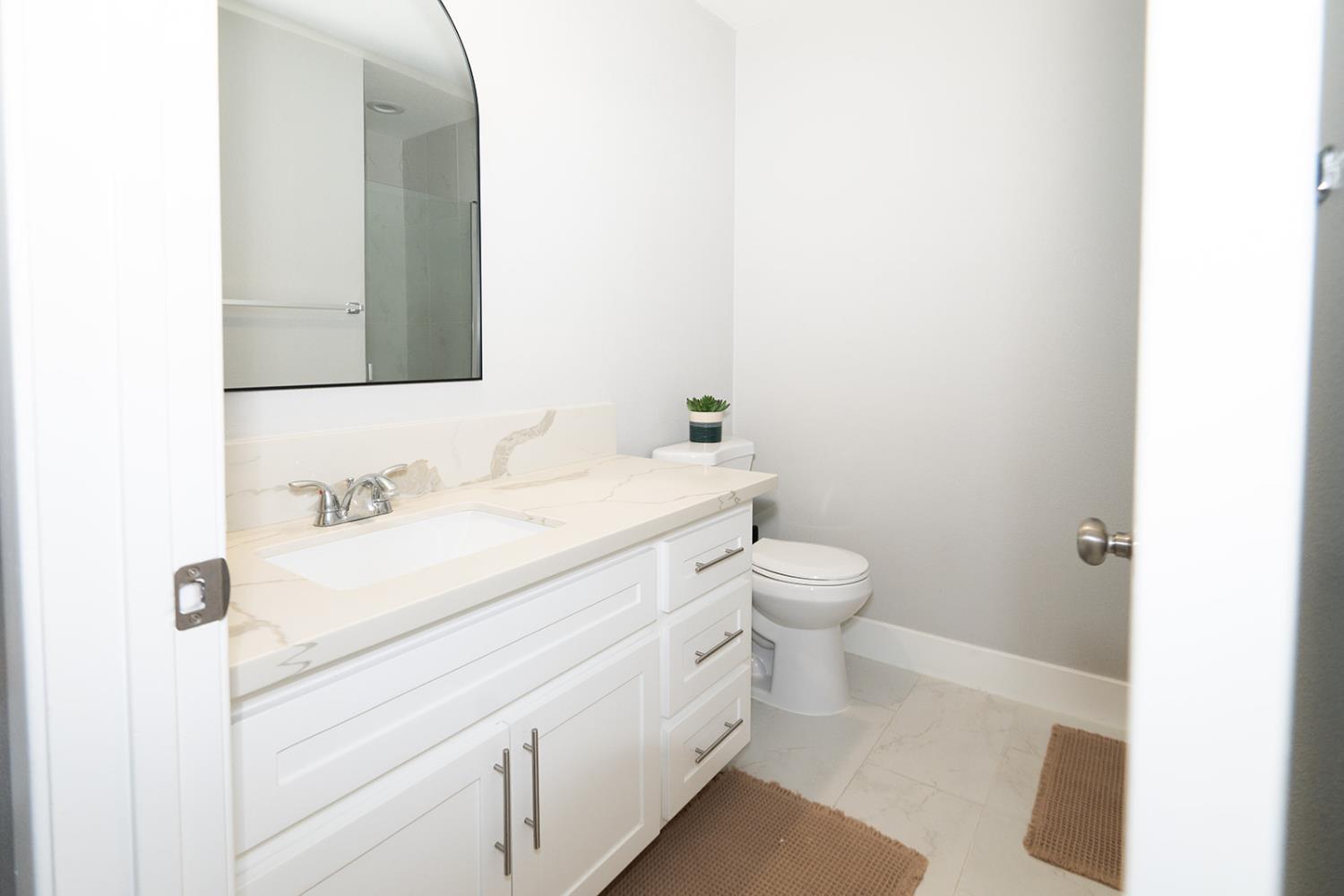 2672 Rio Bravo Circle Sacramento, CA 95826 - Photo 20 of 26 a bathroom with a sink a toilet and mirror