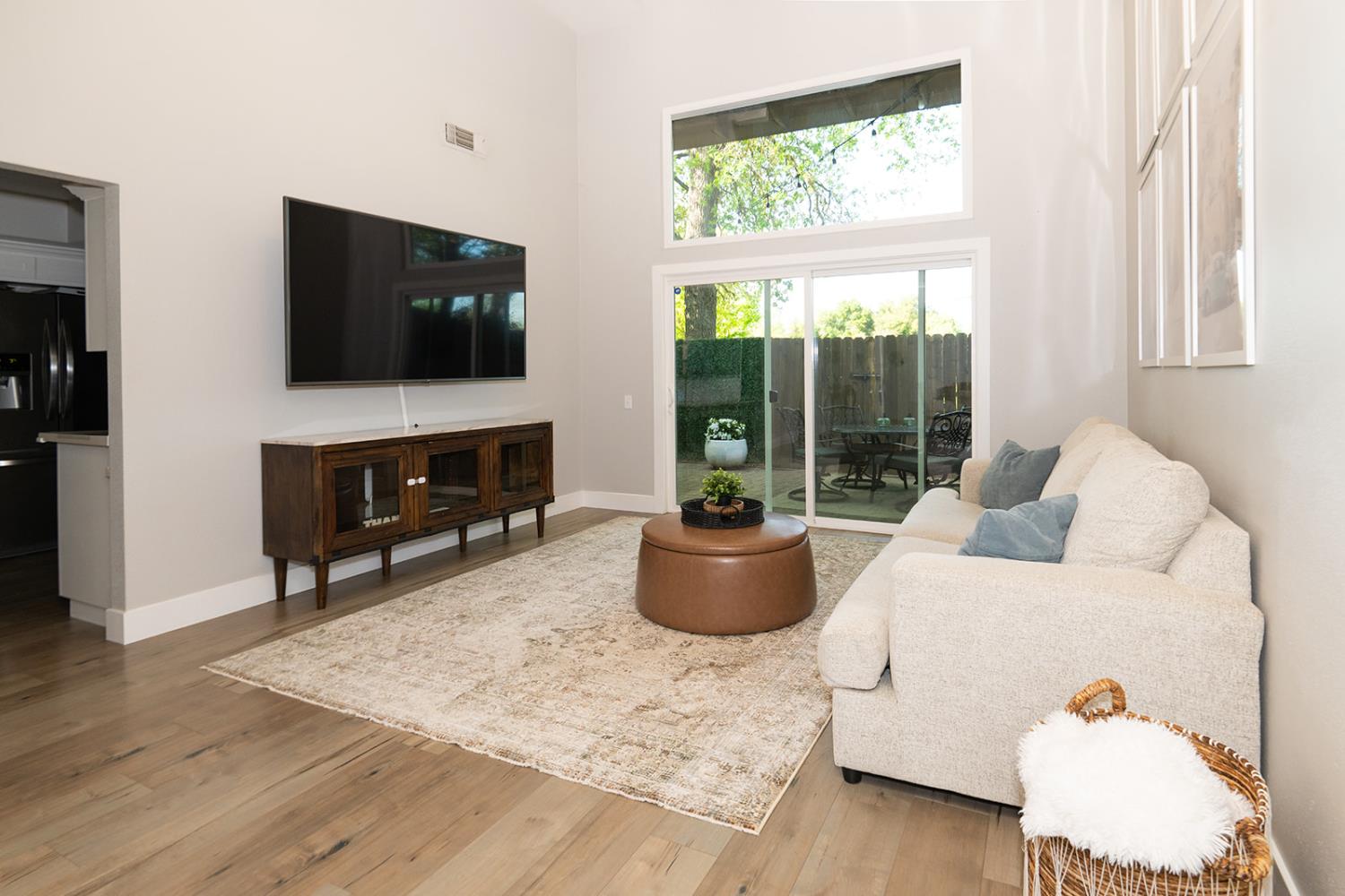 2672 Rio Bravo Circle Sacramento, CA 95826 - Photo 2 of 26 a living room with a flat screen tv and a window