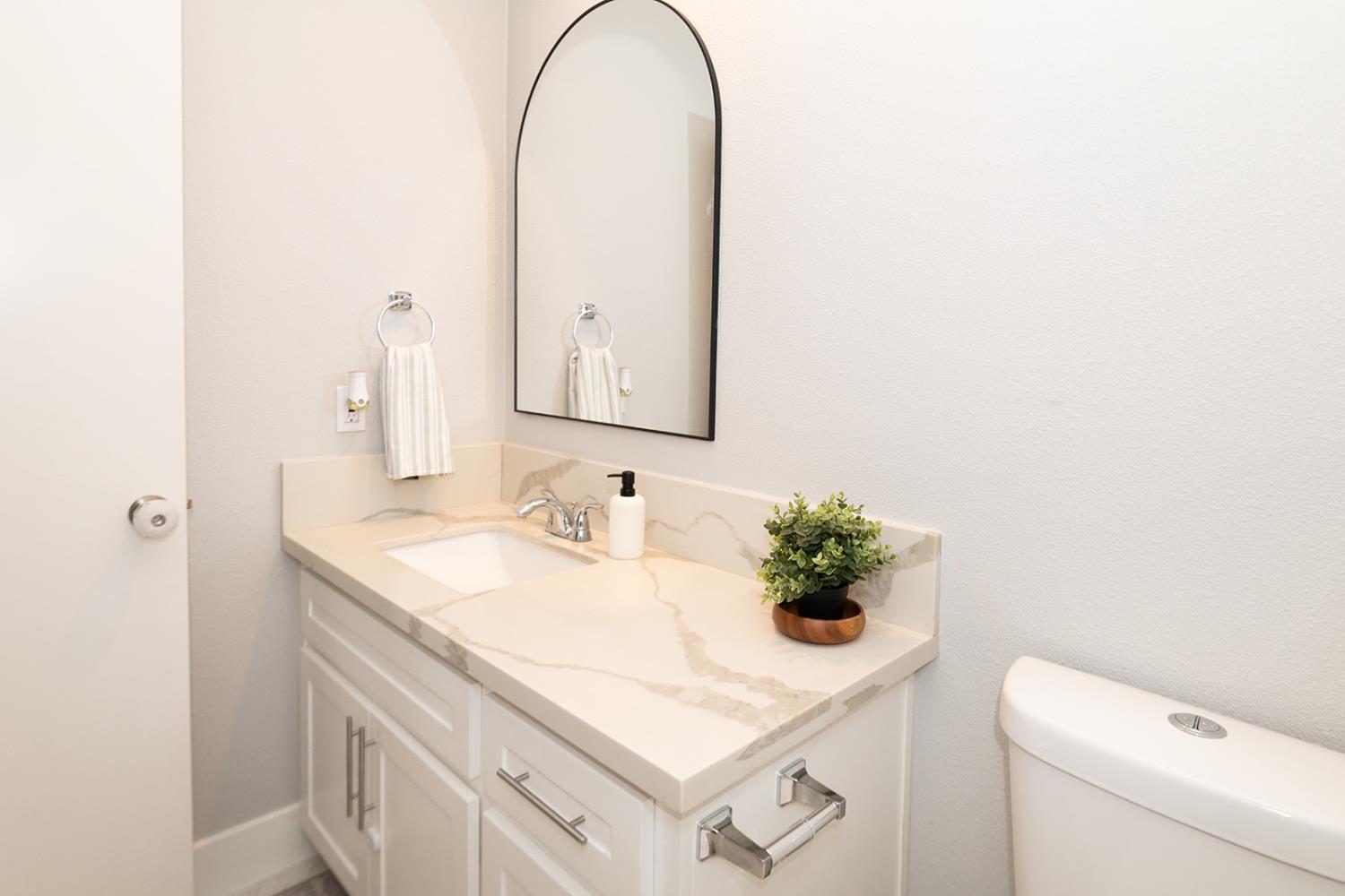 2672 Rio Bravo Circle Sacramento, CA 95826 - Photo 21 of 26 a bathroom with a sink vanity and a mirror