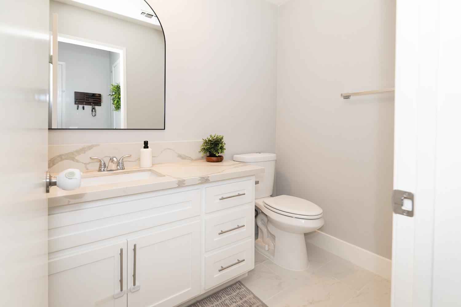 2672 Rio Bravo Circle Sacramento, CA 95826 - Photo 22 of 26 a bathroom with a sink toilet and mirror