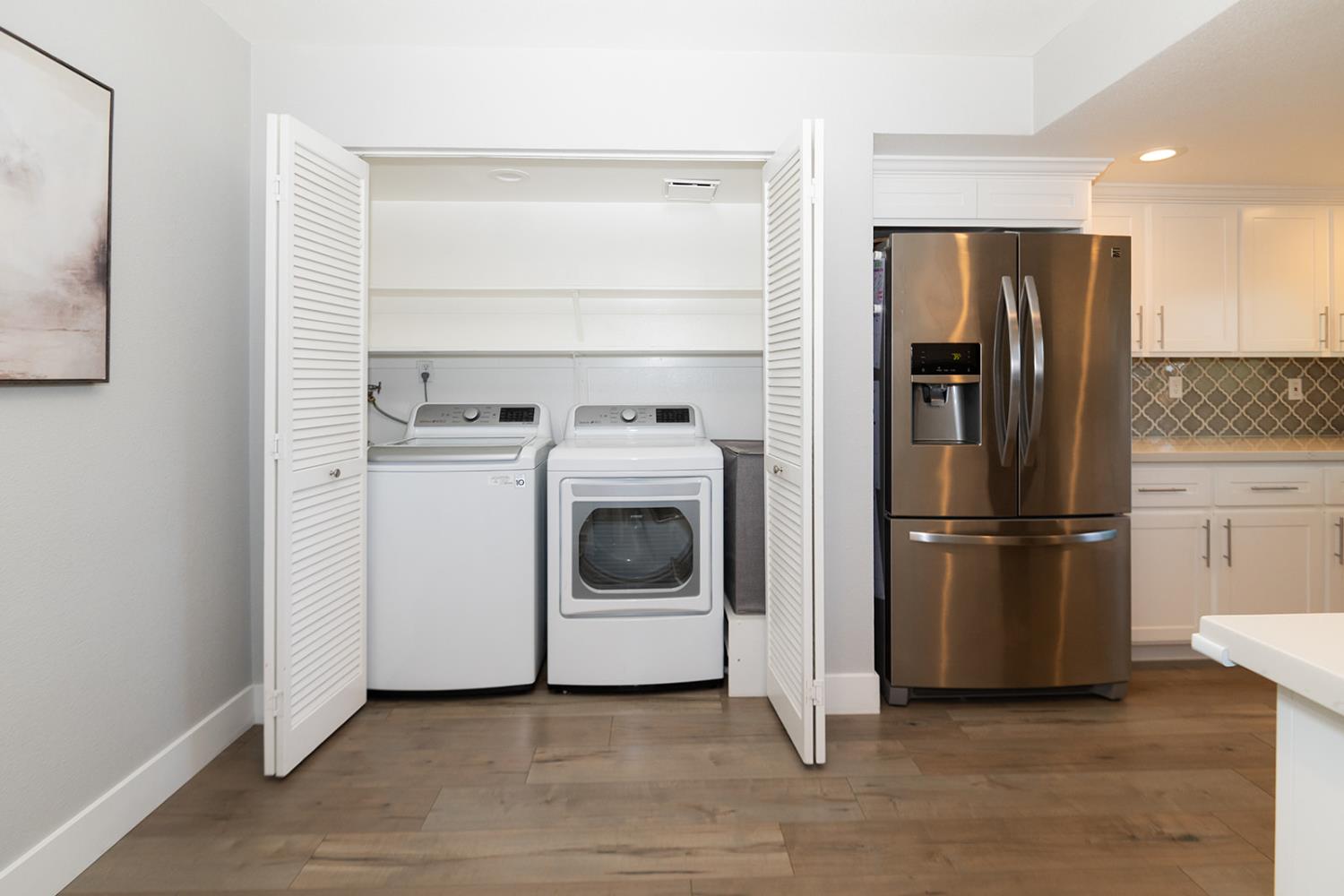 2672 Rio Bravo Circle Sacramento, CA 95826 - Photo 9 of 26 a kitchen with a refrigerator sink and cabinets