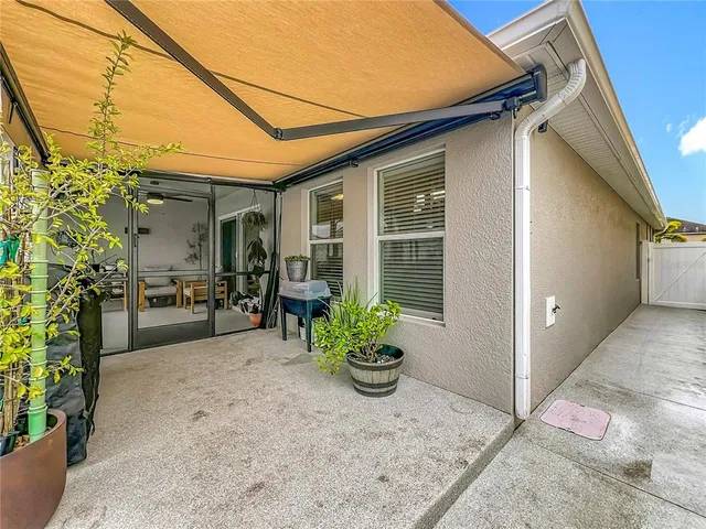 an aerial view of houses with a swimming pool
