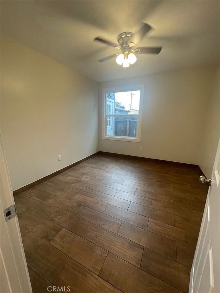 1413 East 53rd Street Los Angeles, CA 90011 - Photo 6 of 11 a view of an empty room with a window