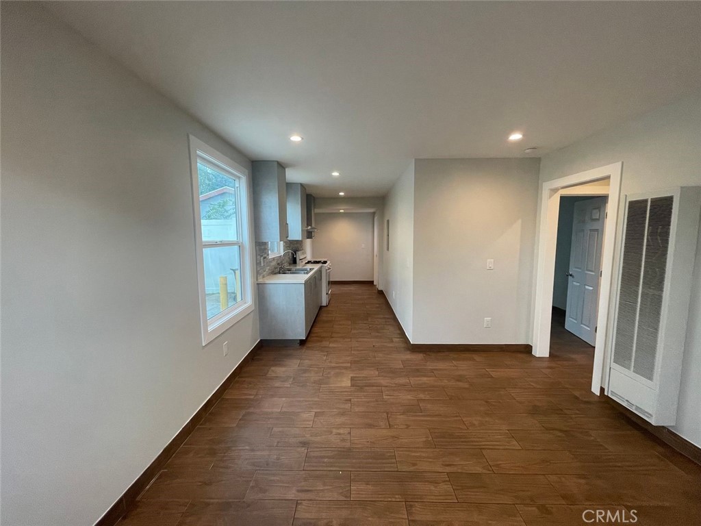 1413 East 53rd Street Los Angeles, CA 90011 - Photo 7 of 11 a view of a kitchen with a refrigerator and a window