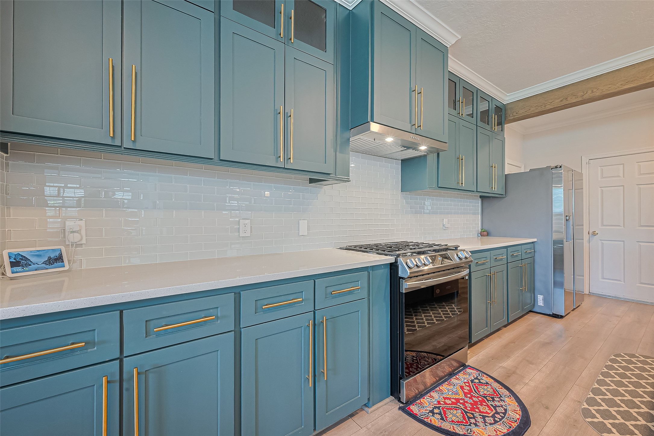 1413 Whispering Pines Drive, Unit 5 Houston, TX 77055 - Photo 12 of 47 a kitchen with stainless steel appliances granite countertop a sink and a stove