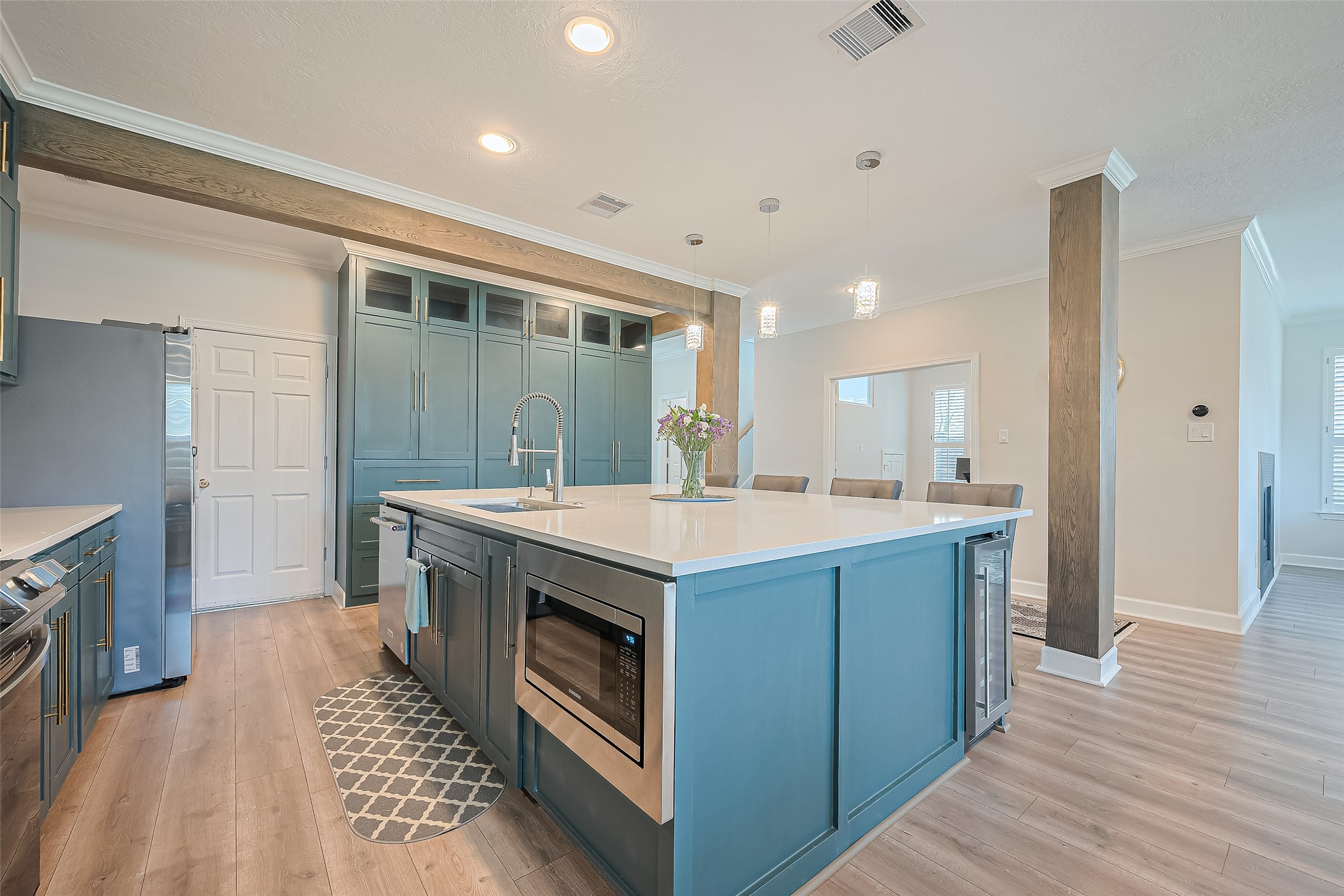 1413 Whispering Pines Drive, Unit 5 Houston, TX 77055 - Photo 13 of 47 a kitchen with wooden cabinets and a sink