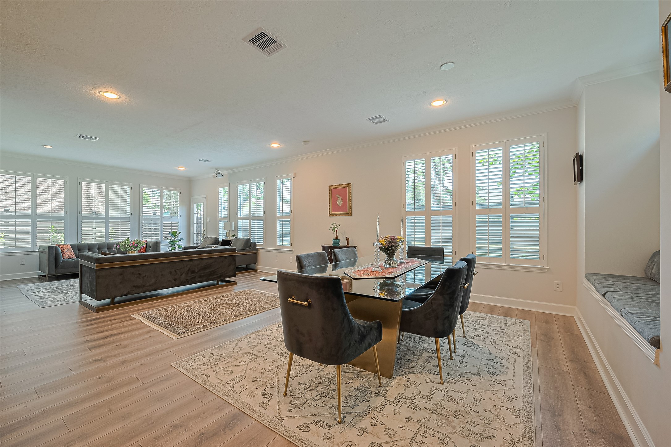 1413 Whispering Pines Drive, Unit 5 Houston, TX 77055 - Photo 16 of 47 a living room with furniture a large window and wooden floor