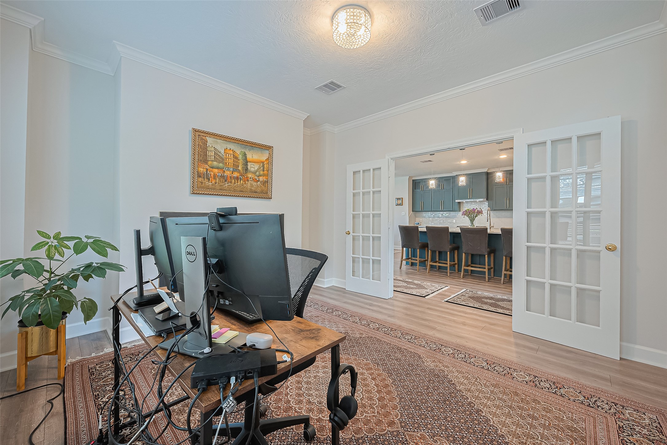 1413 Whispering Pines Drive, Unit 5 Houston, TX 77055 - Photo 18 of 47 a workspace with furniture and a potted plant