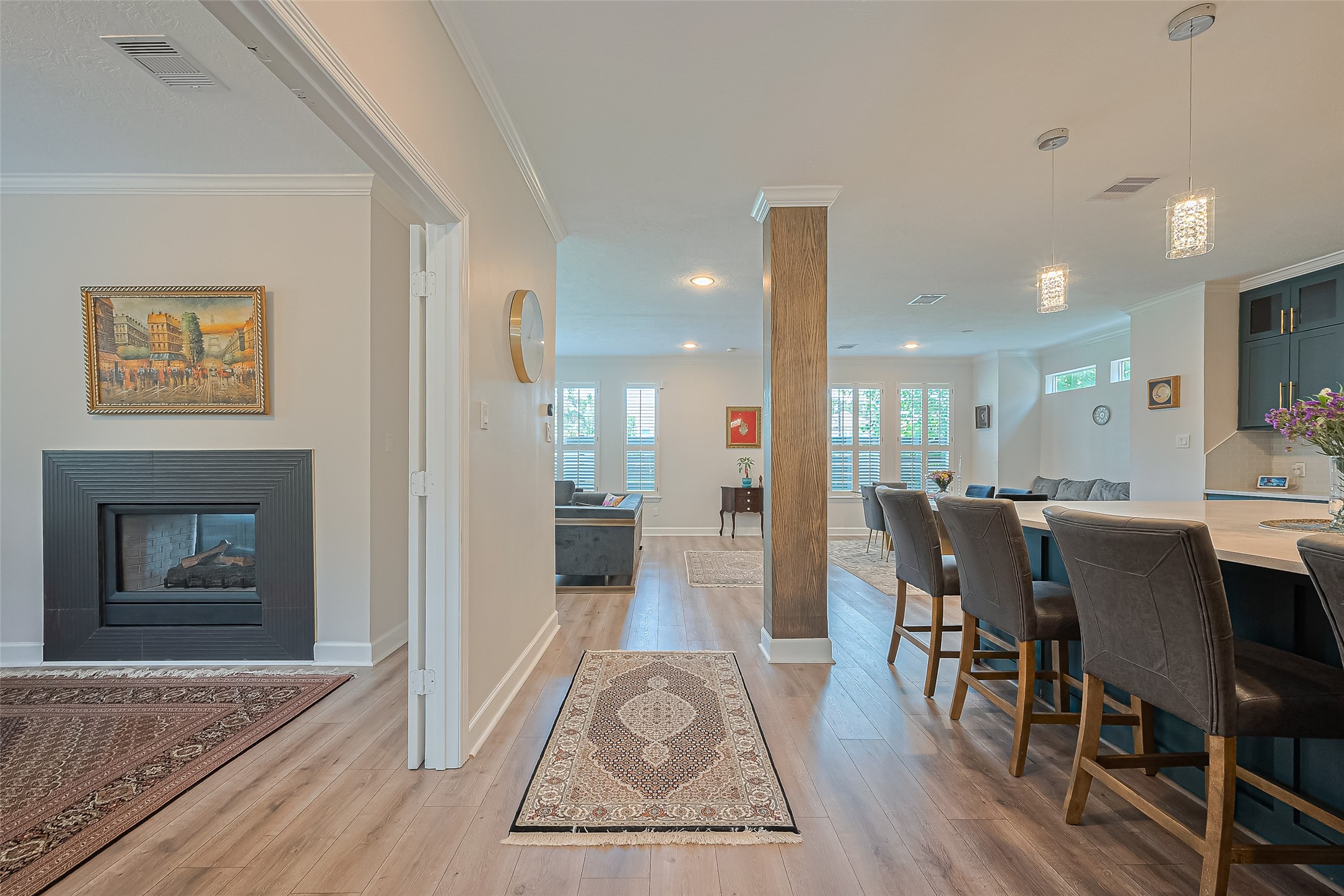 1413 Whispering Pines Drive, Unit 5 Houston, TX 77055 - Photo 2 of 47 a view of a dining room with furniture and wooden floor