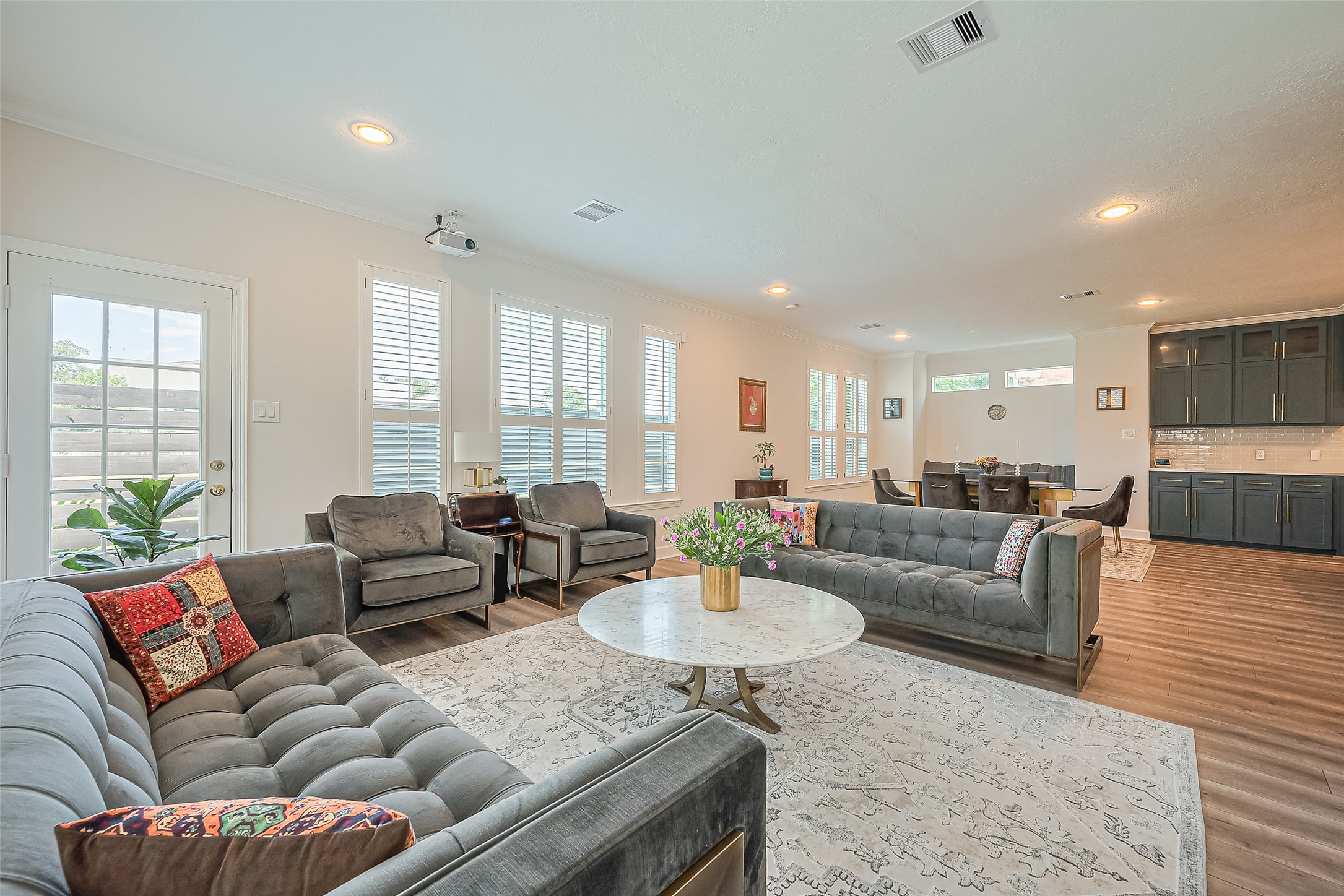1413 Whispering Pines Drive, Unit 5 Houston, TX 77055 - Photo 23 of 47 a living room with furniture and a table