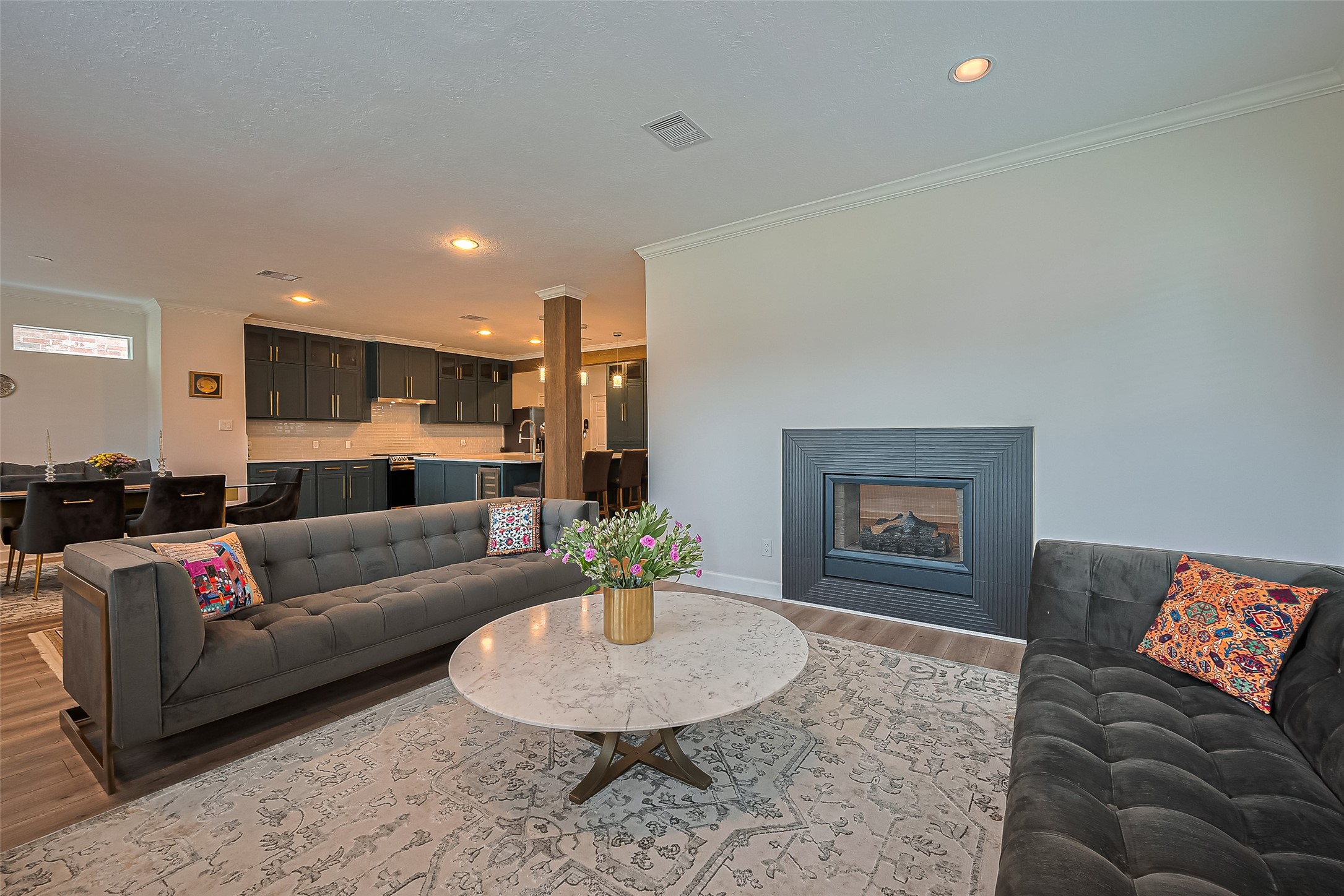 1413 Whispering Pines Drive, Unit 5 Houston, TX 77055 - Photo 24 of 47 a living room with furniture and a dining table