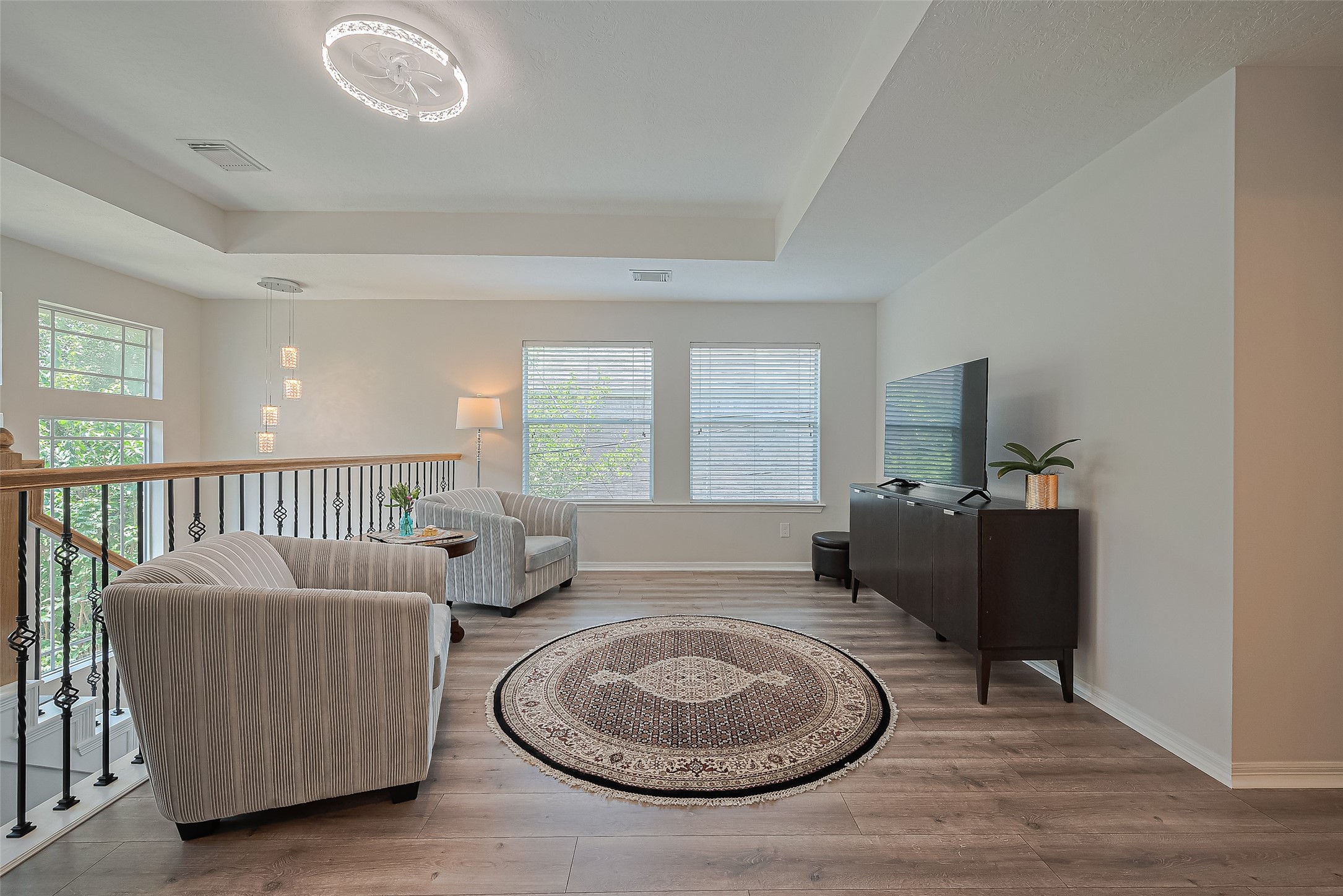 1413 Whispering Pines Drive, Unit 5 Houston, TX 77055 - Photo 27 of 47 a living room with furniture and a window
