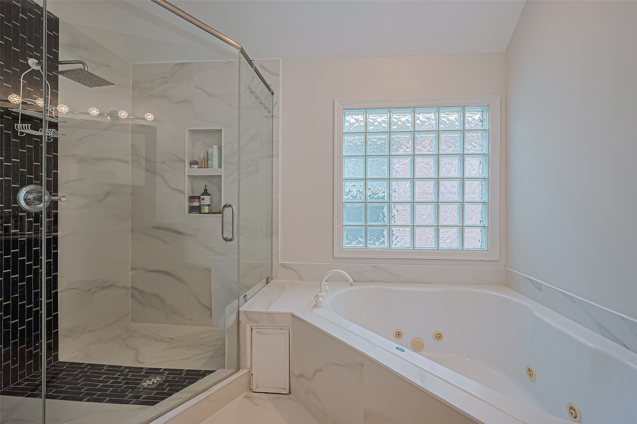 1413 Whispering Pines Drive, Unit 5 Houston, TX 77055 - Photo 35 of 47 a bathroom with a bathtub and shower