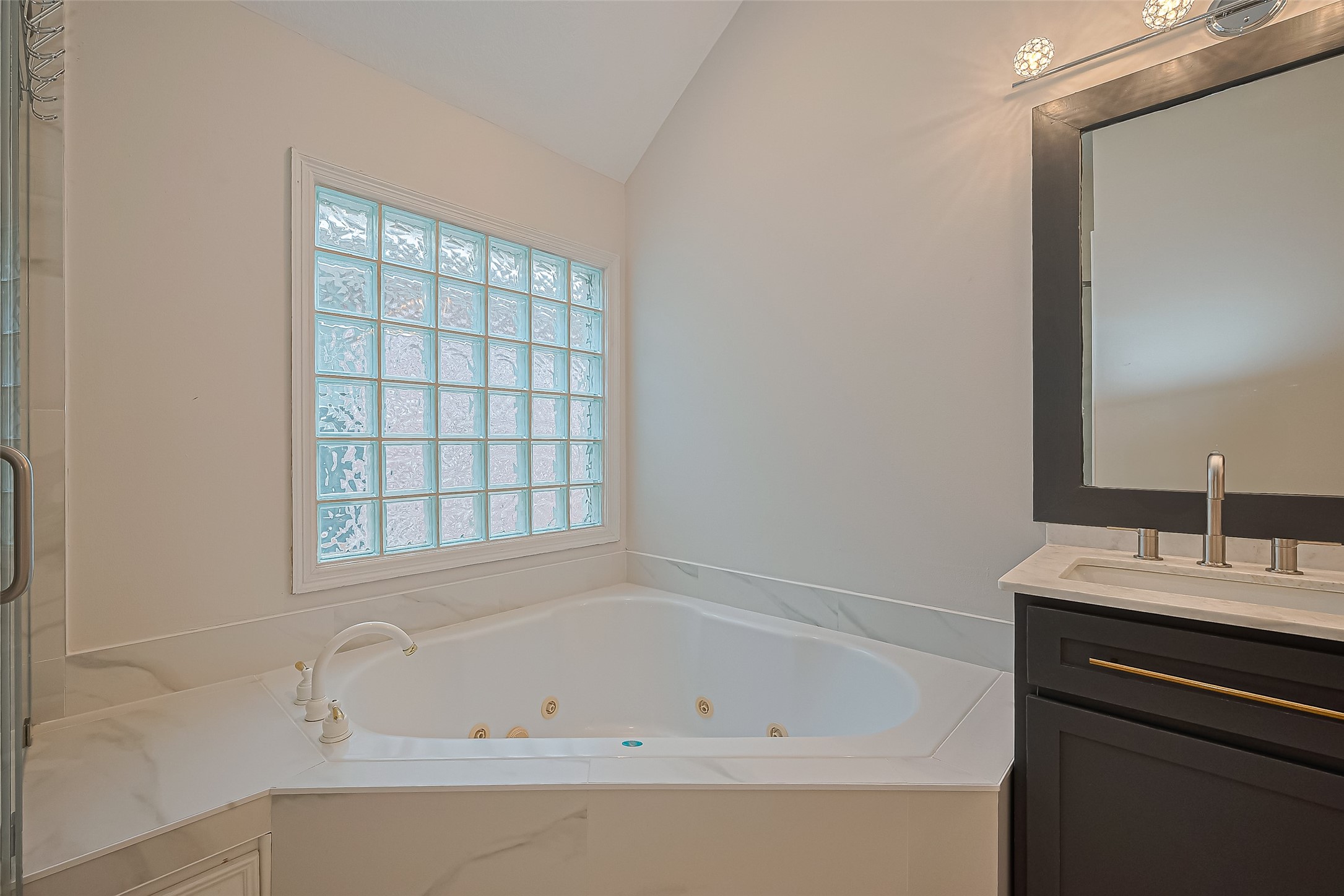 1413 Whispering Pines Drive, Unit 5 Houston, TX 77055 - Photo 36 of 47 a white bath tub sitting next to a white sink