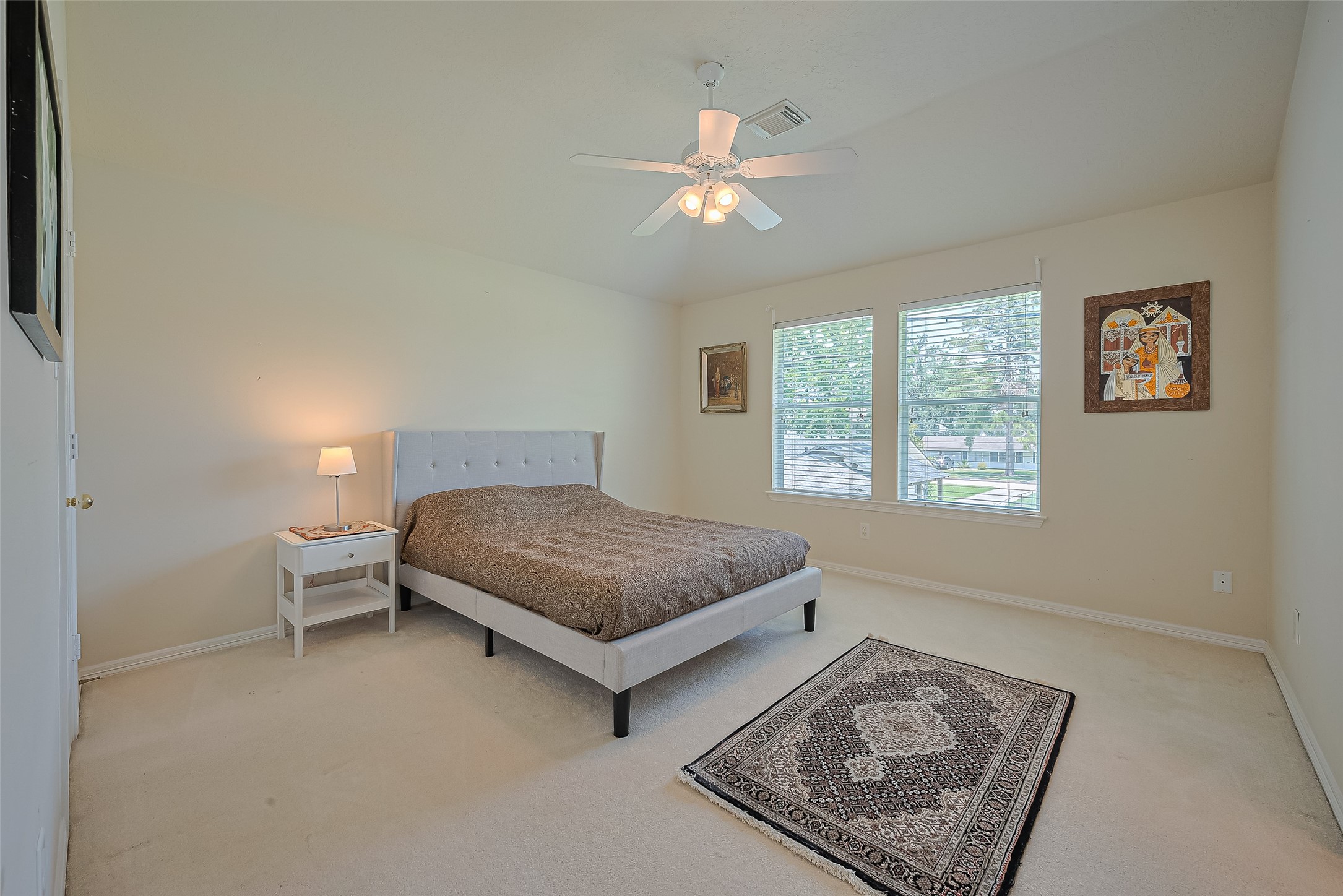 1413 Whispering Pines Drive, Unit 5 Houston, TX 77055 - Photo 37 of 47 a bedroom with a bed and window