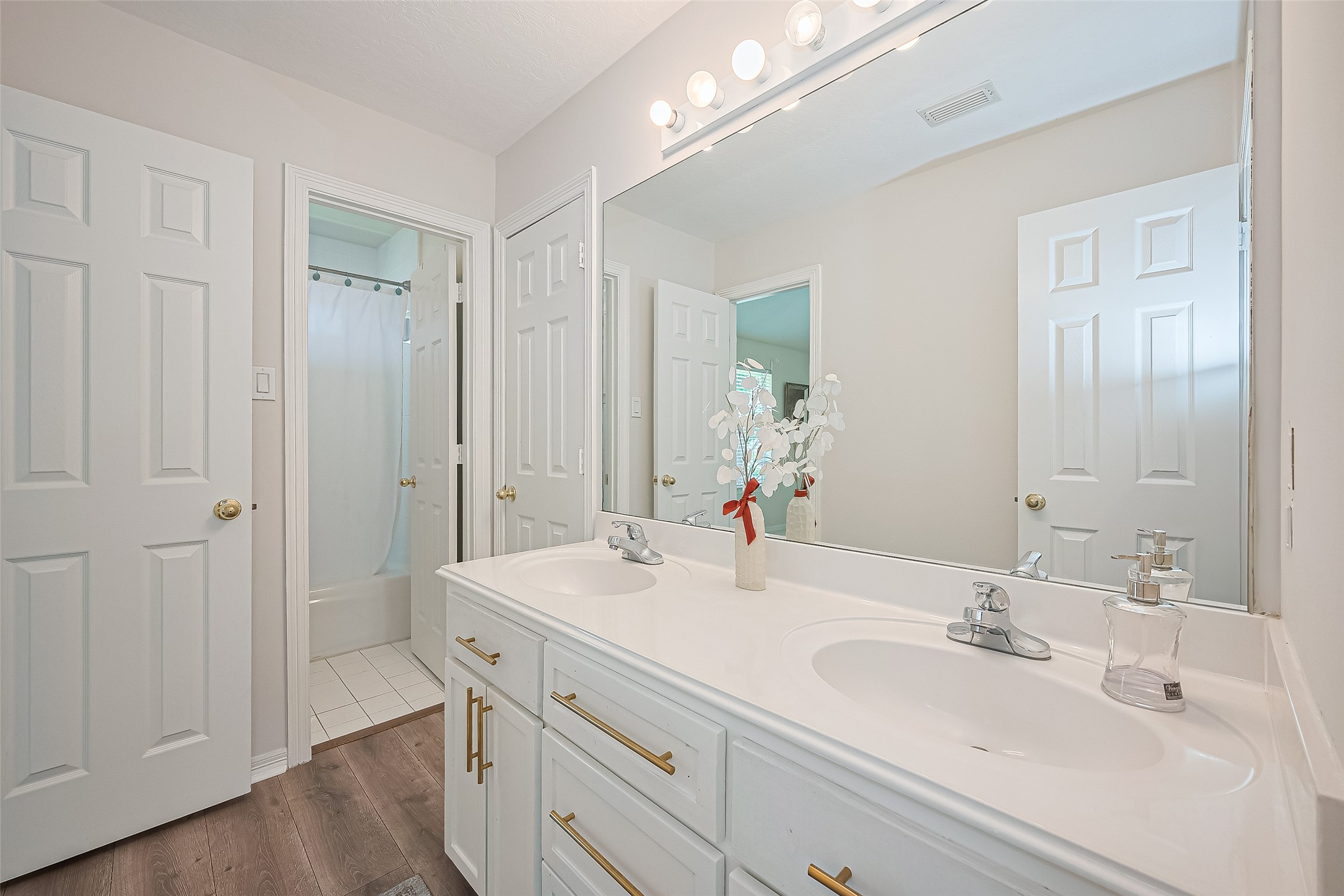 1413 Whispering Pines Drive, Unit 5 Houston, TX 77055 - Photo 41 of 47 a bathroom with a sink and a mirror