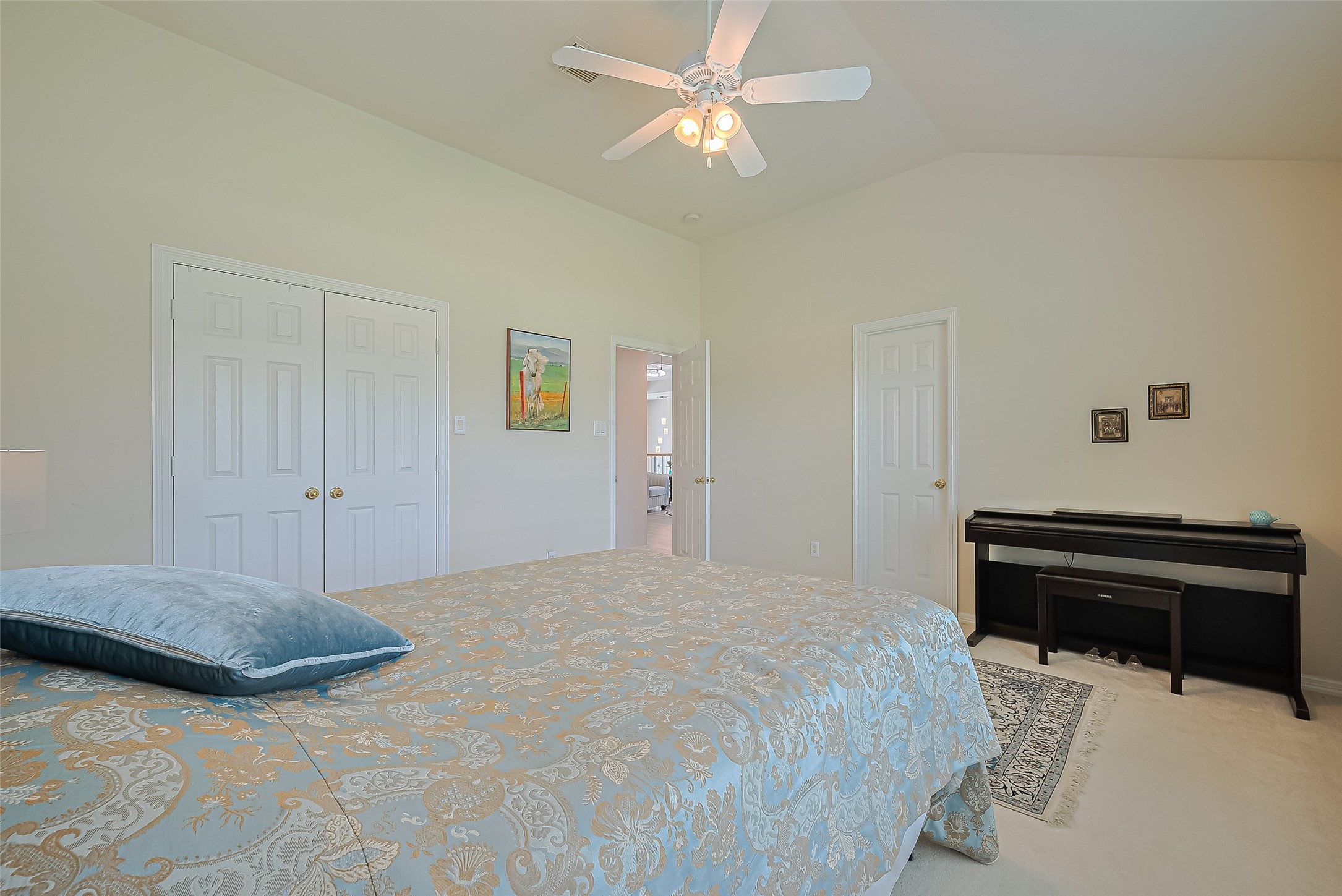 1413 Whispering Pines Drive, Unit 5 Houston, TX 77055 - Photo 43 of 47 a bedroom with a bed and a chandelier