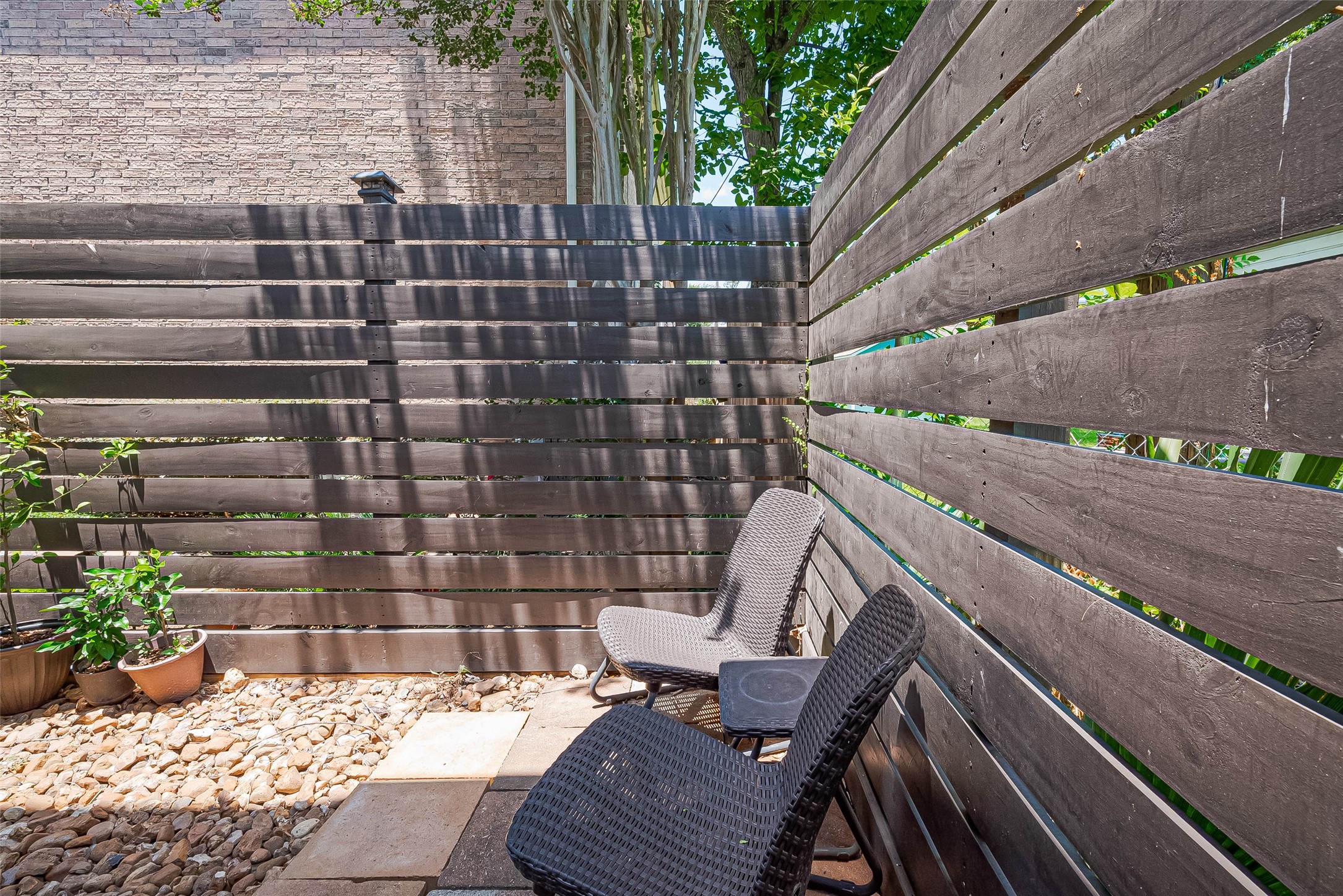 1413 Whispering Pines Drive, Unit 5 Houston, TX 77055 - Photo 44 of 47 a view of an outdoor sitting area with brick walls