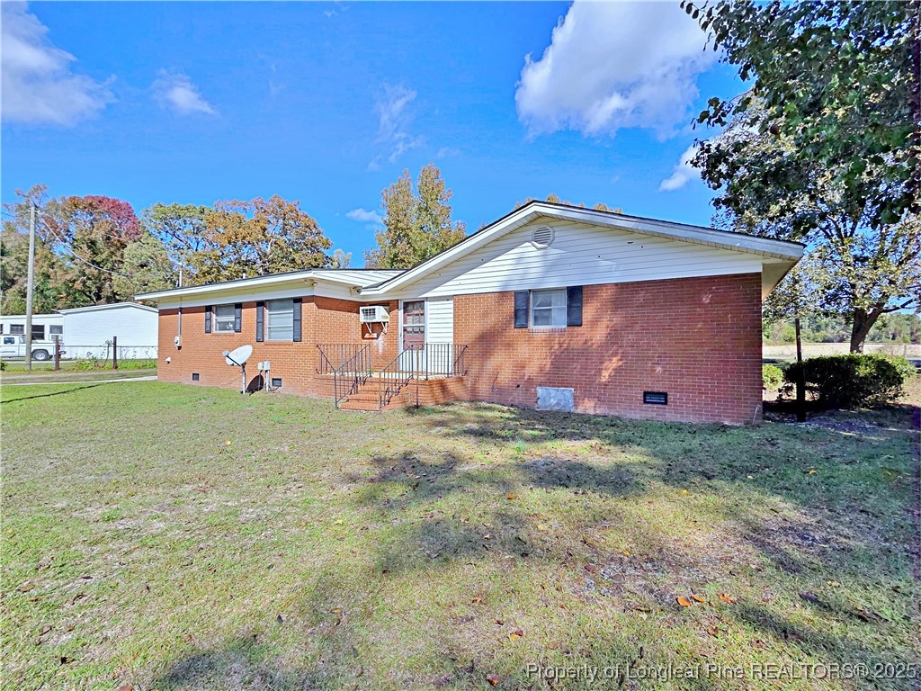 764 Old Vander Road Fayetteville, NC 28312 - Photo 27 of 50 a front view of a house with garden