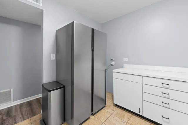 a view of a closet in kitchen