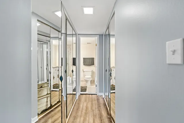 a view of a bathroom with a glass door shower and a sink