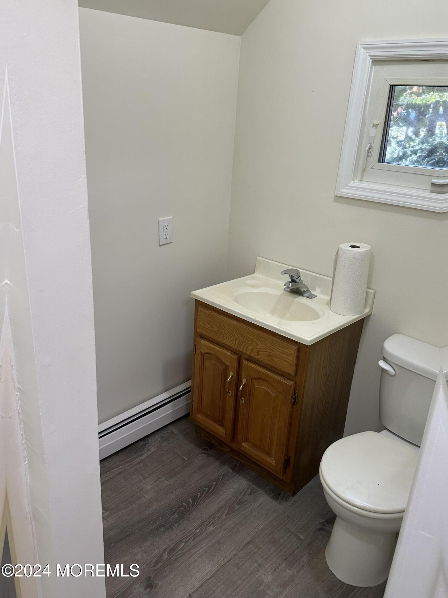 1 Leonardville Road, Unit C Middletown, NJ 07748 - Photo 10 of 12 a bathroom with a sink toilet and vanity