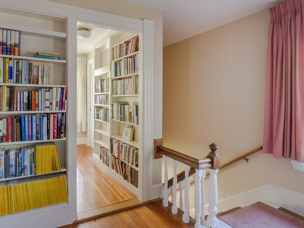 10 Jordan Pond Road Seal Harbor, ME 04675 - Photo 20 of 32 A hallway with bookshelves and...