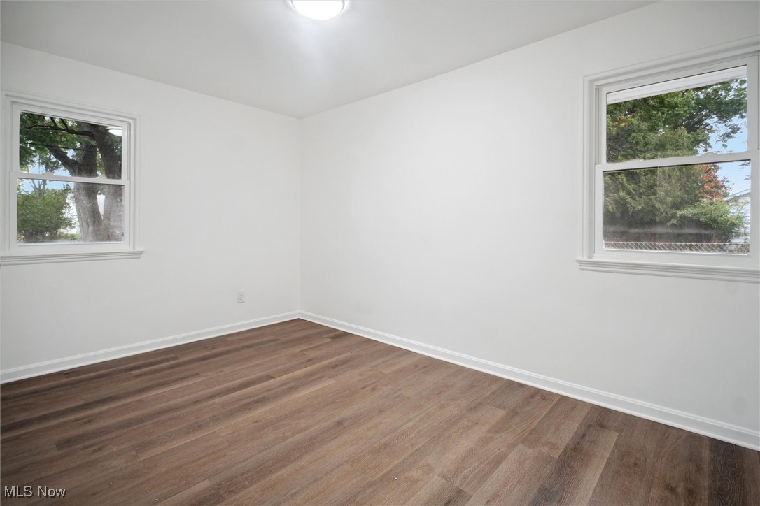 8796 West Ridgewood Drive Cleveland, OH 44130 - Photo 26 of 38 Empty room with wood-type flooring and plenty of natural light