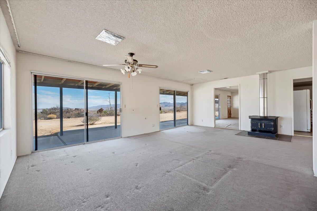 61313 El Coyote Lane Joshua Tree, CA 92252 - Photo 16 of 48 a view of a livingroom with a staircase