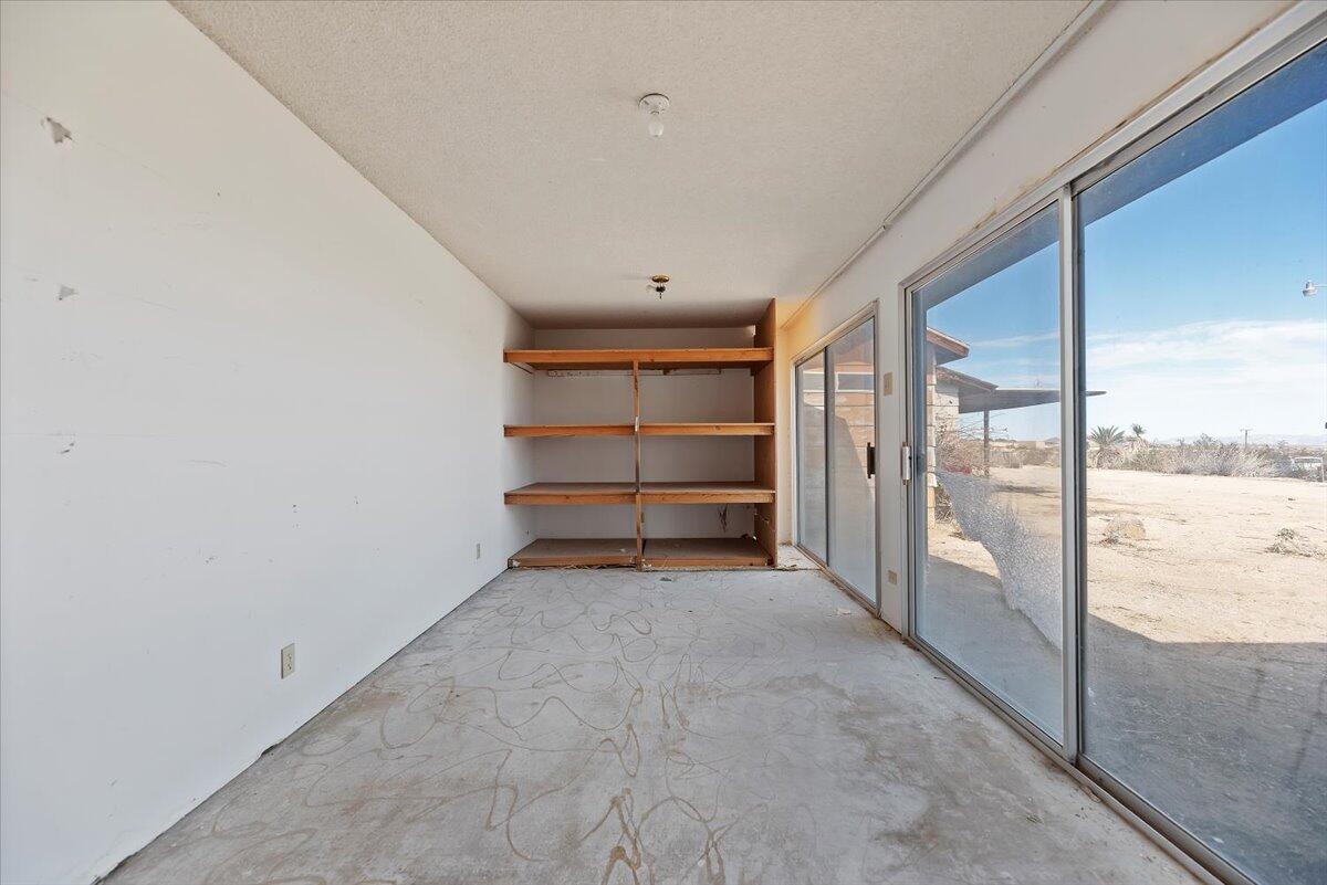 61313 El Coyote Lane Joshua Tree, CA 92252 - Photo 36 of 48 a view of an empty room with a window