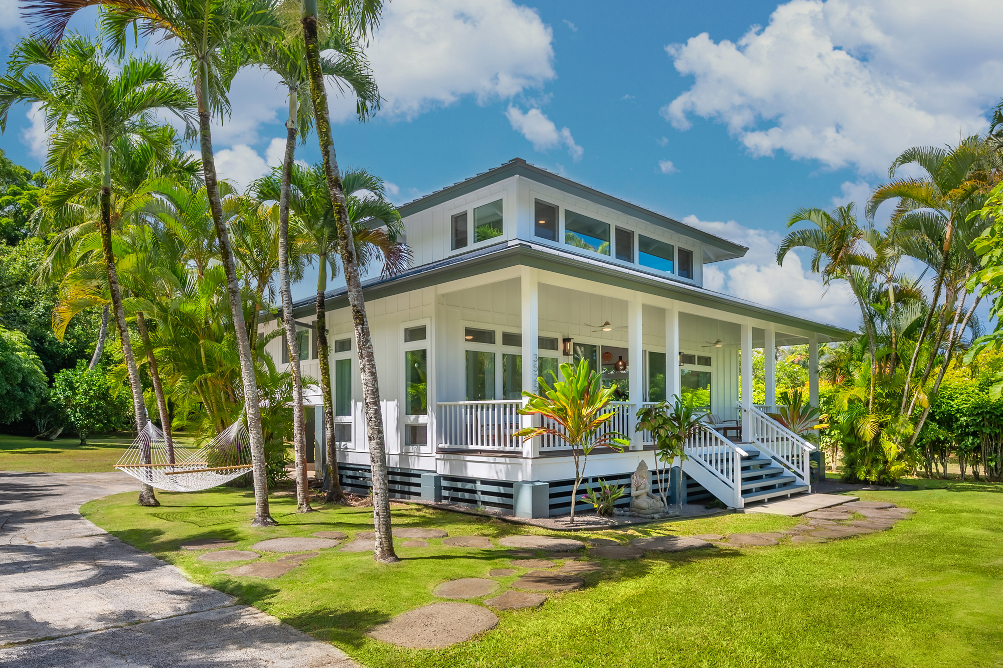 3525 Anini Road Princeville, HI 96722 - Photo 1 of 2 a view of a house with backyard porch and sitting area