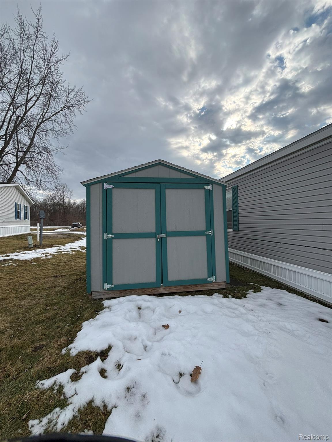 246 South Sheridan Road Lennon, MI 48449 - Photo 12 of 12 Snow covered structure with a shed