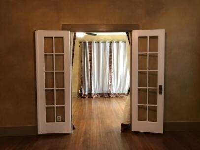 2311 16th Street Lubbock, TX 79401 - Photo 14 of 30 an empty room with wooden floor and a window
