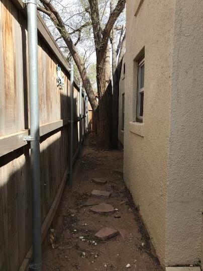 2311 16th Street Lubbock, TX 79401 - Photo 28 of 30 a pathway of a house with a yard