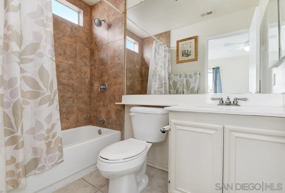 2563 Kings View Circle Spring Valley, CA 91977 - Photo 14 of 27 a bathroom with a sink a toilet and a bathtub